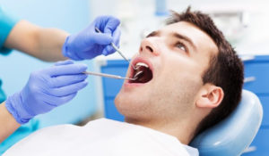 Dentist working on patient