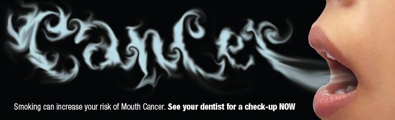 woman blowing out smake spelling cancer
